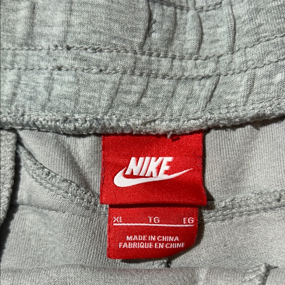 Nike Men’s Light Gray Athletic Shorts with Blue Drawstring and Zipper Pocket - Picture 2 of 7
